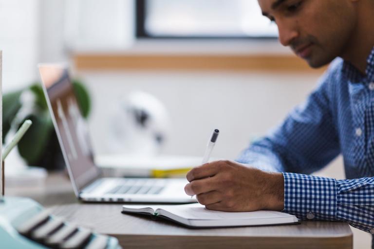 Man studying at a laptop